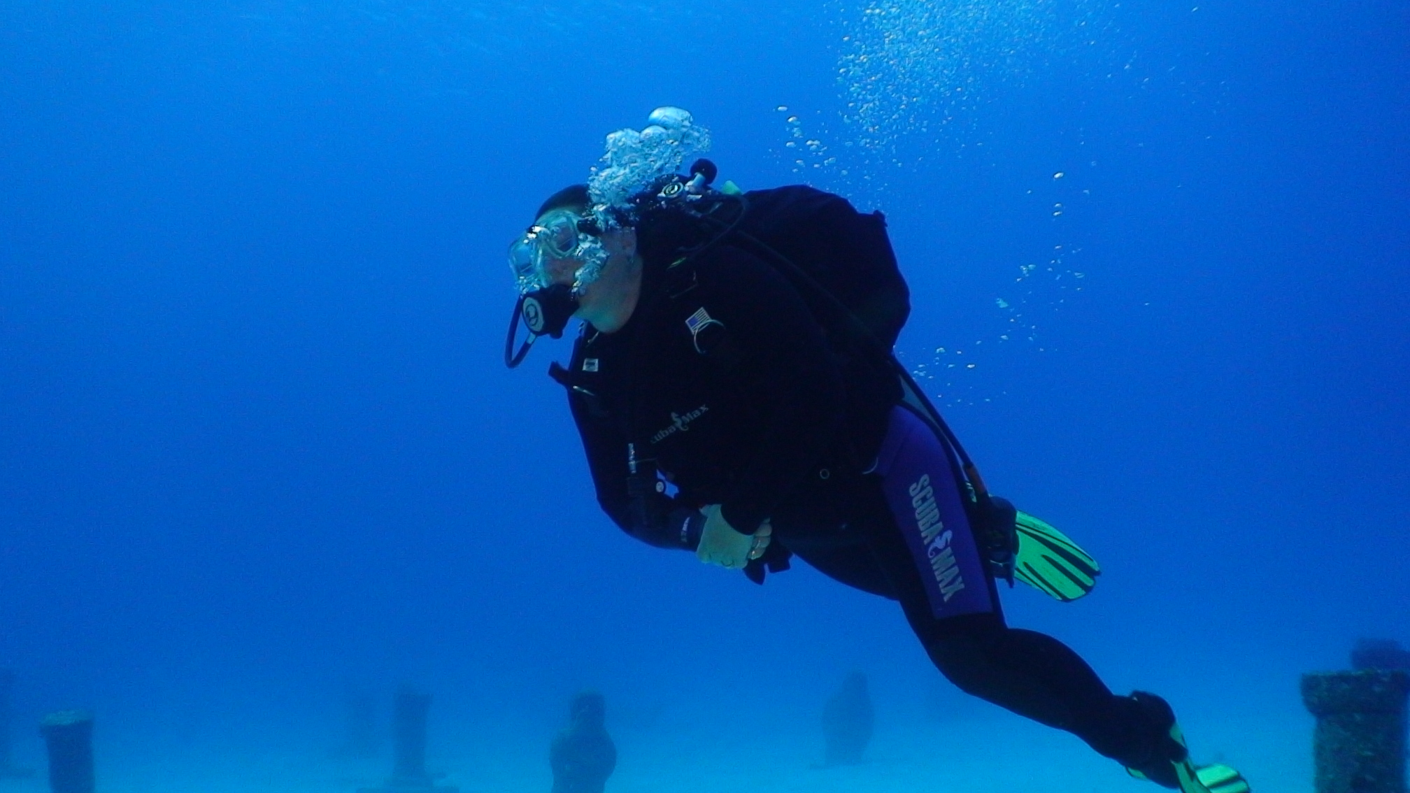 diver jumping into water